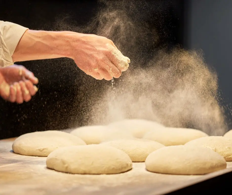 dusting dough before shaping