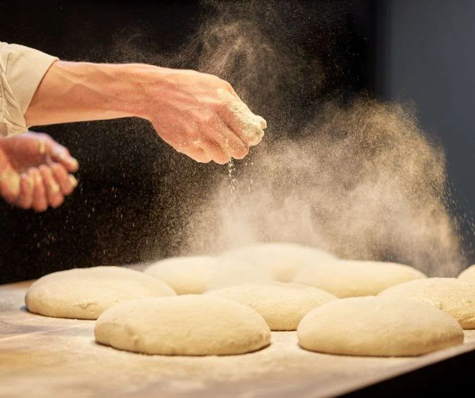 dusting dough before shaping